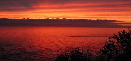 Beautiful sunset taken at approxiately 1:30 a.m. in June from the campground where we offer our Alaska fishing charters.